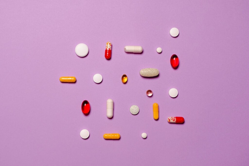 medication pills isolated on purple background